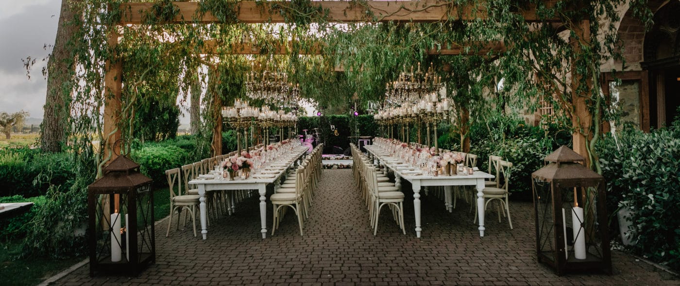 Romantic wedding dinner under the pergola in Tuscany