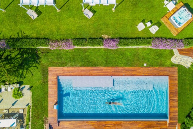 Aerial view of the pool in the garden of villa in the Italian Riviera