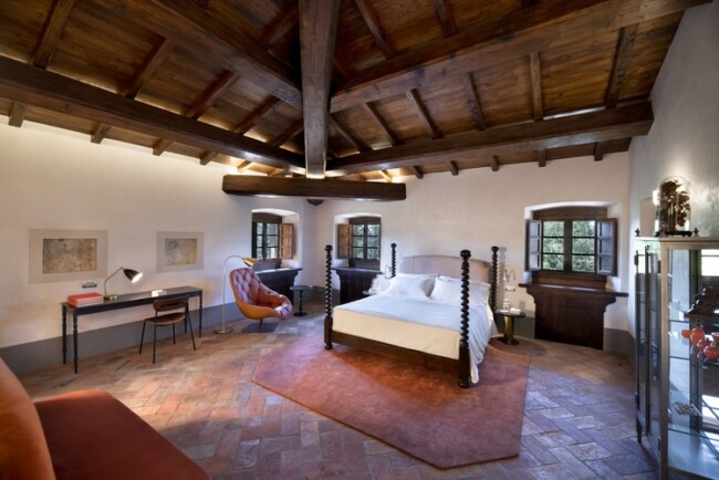 Bedroom with wooden ceiling at wedding villa in Chianti