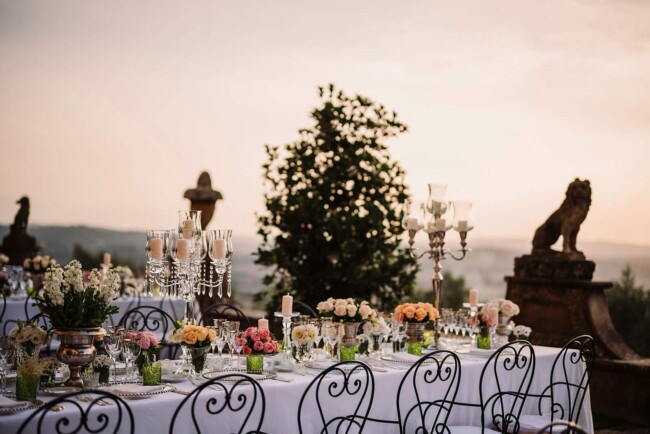 Candelabra on elegant tables at wedding villa with view in Florence