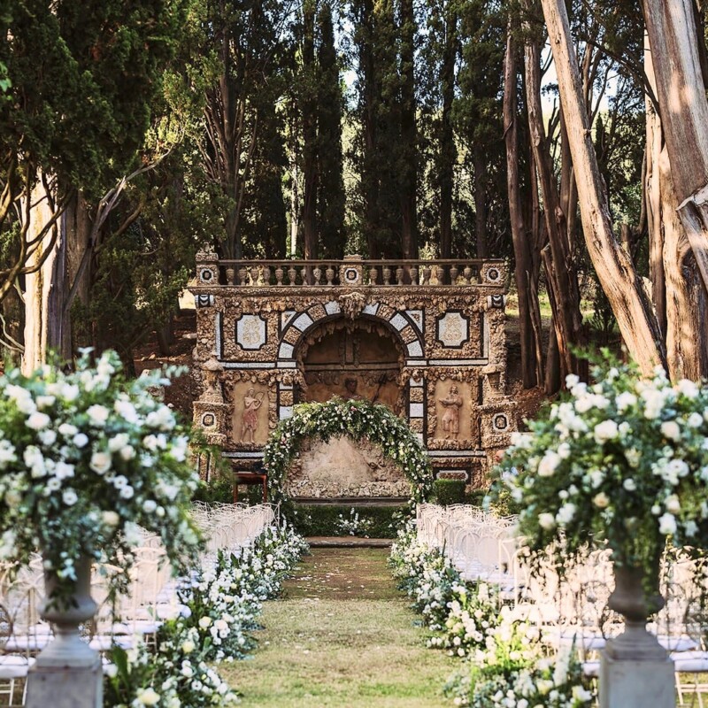 Ceremony with white flowers at wedding villa with view in Florence