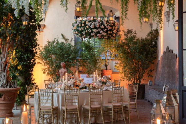 Hanging greenery and lanterns for a secret garden wedding decor in Italy