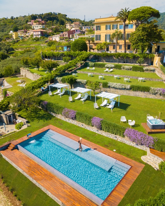 Panoramic view of the garden and pool at villa in the Italian Riviera