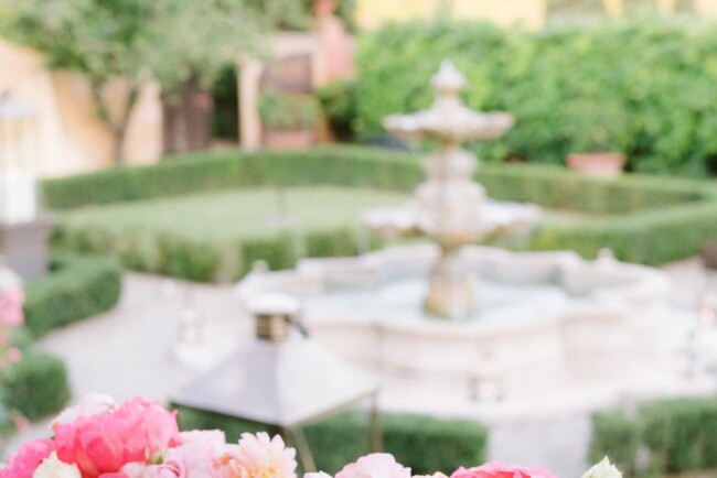 Italian style romantic garden with fountain in Italy