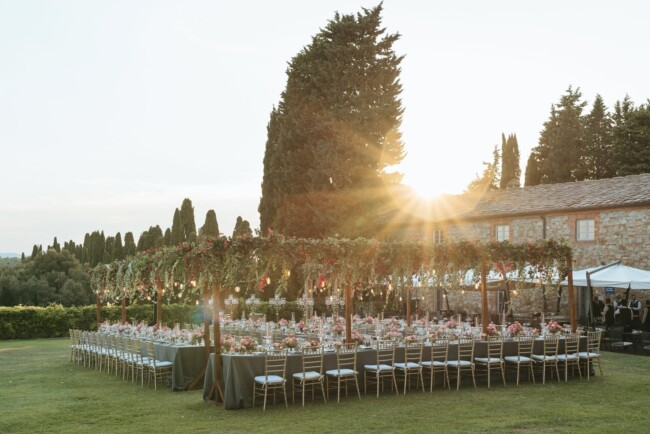 View of table set up in the garden of elegant wedding villa in Italy