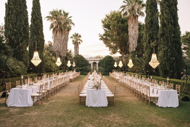 Table set up with chandeliers at wedding venue in Sicily