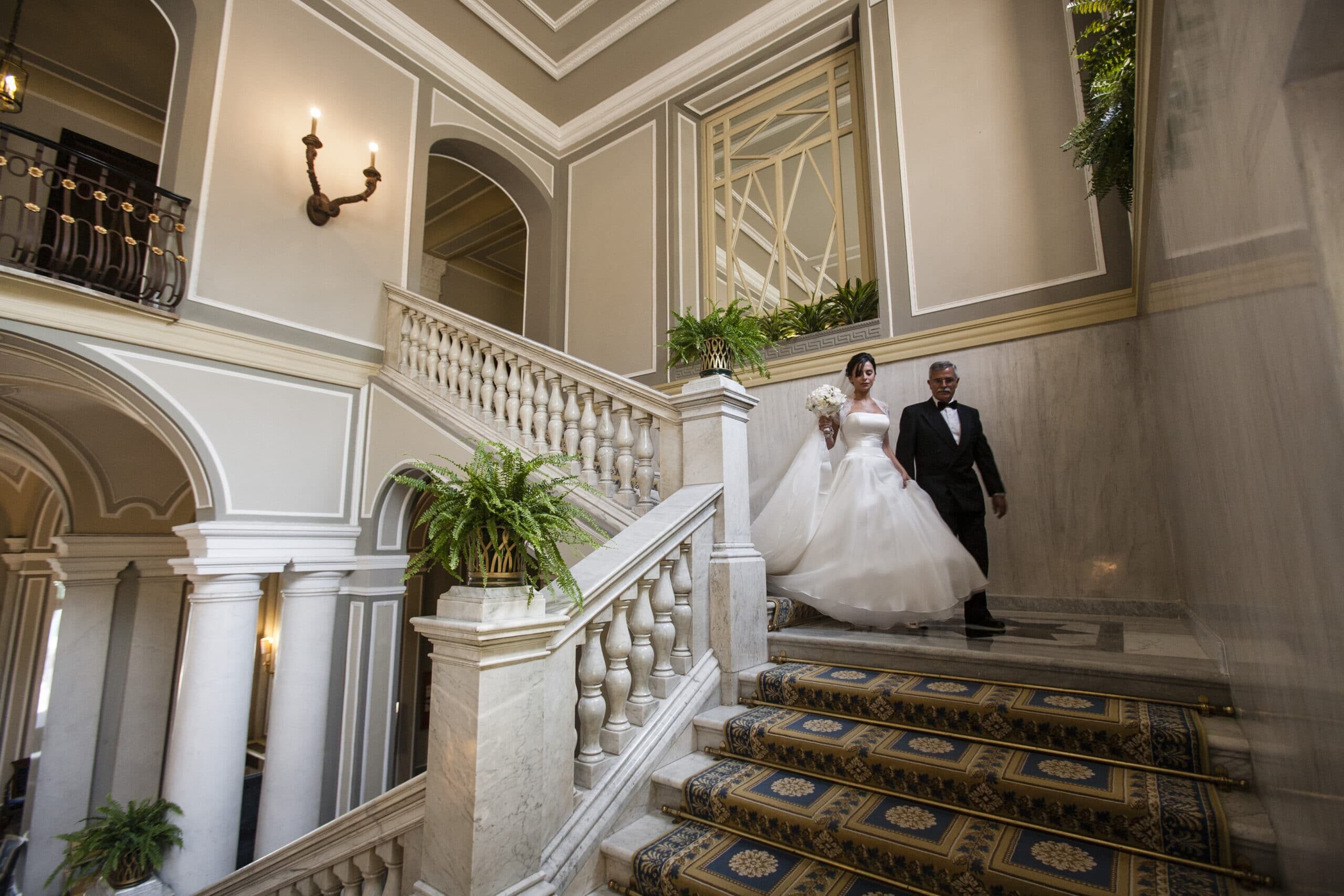 The newlyweds on the stairs at Villa d'Este in Lake Como