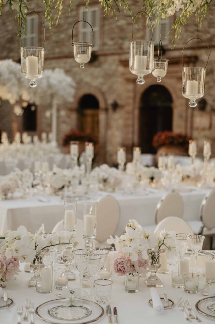 All white decor with orchids and hanging candles