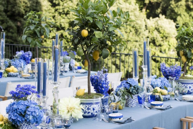 Table with blue tablecloth and folding chairs