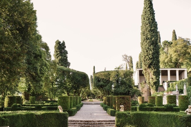 Alley along the Italian gardens of wedding villa on  Lake Garda