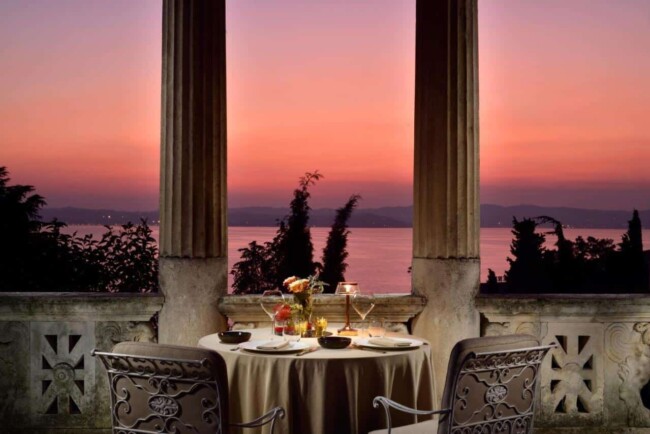Romantic table and sunset view of Lake Garda from wedding reception venue