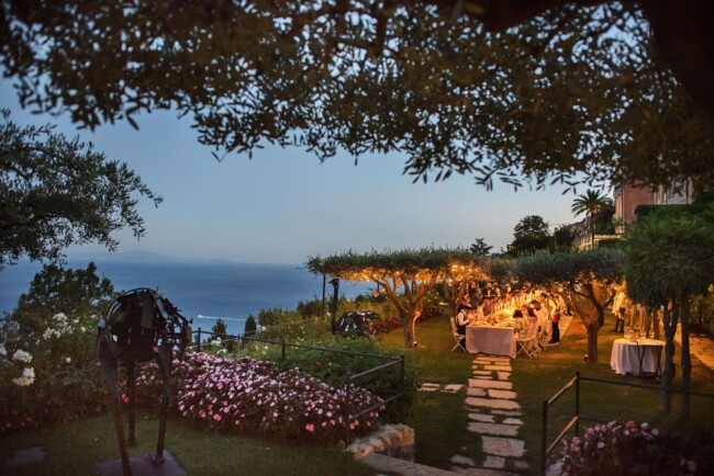 Candle light wedding dinner by the olive trees