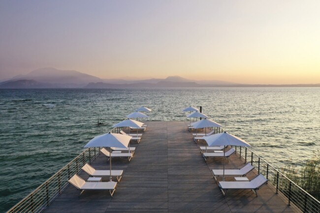 Pier at sunset hour of Lake Garda wedding hotel