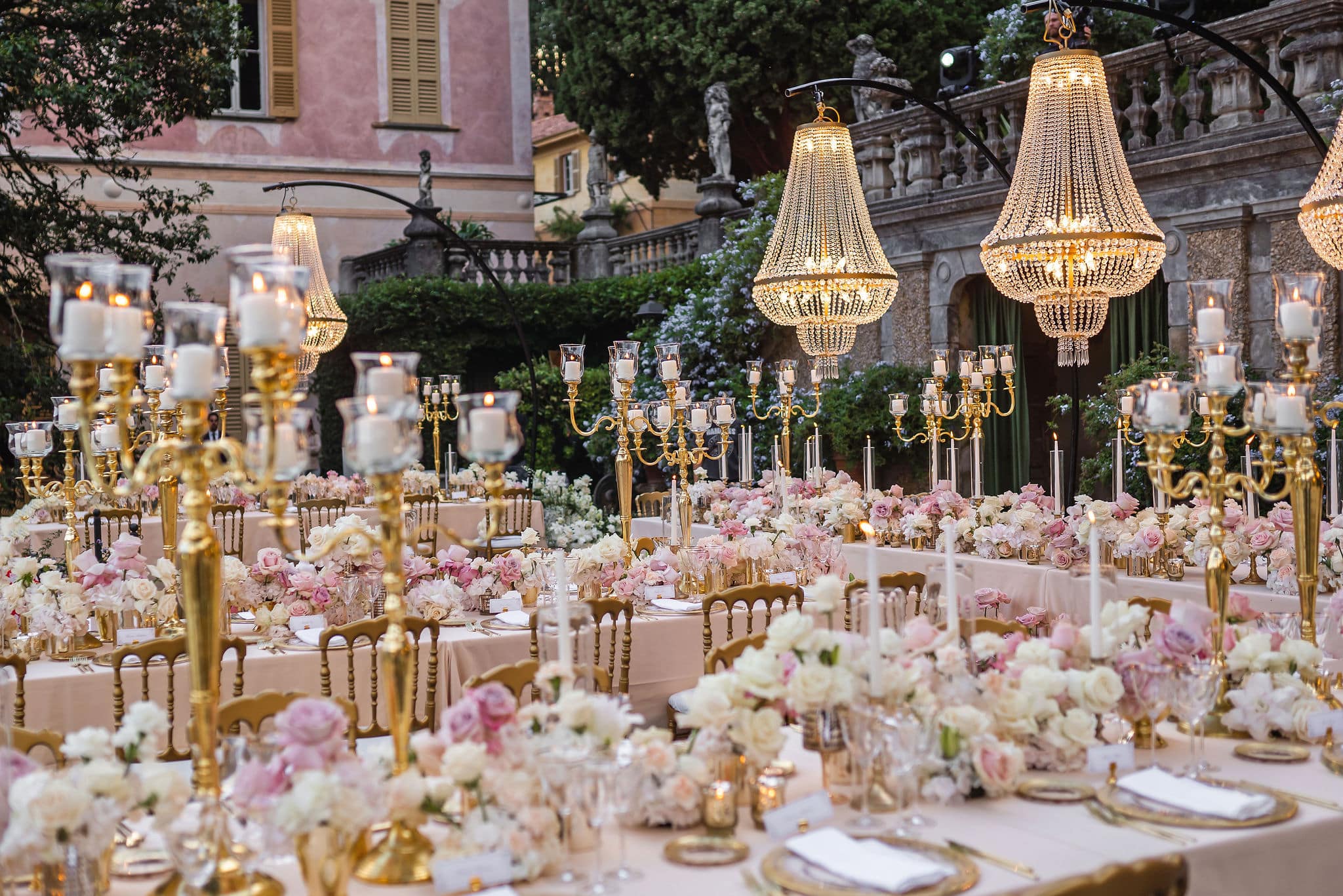 Luxury tables with pastel flowers and gold candelabras