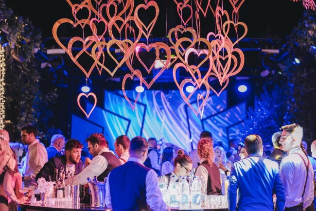 Central bar with falling hearts at party