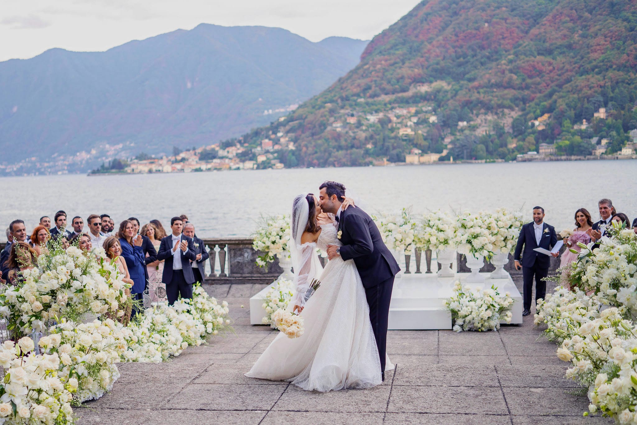 Bride and groom kissing at Lake Como wedding