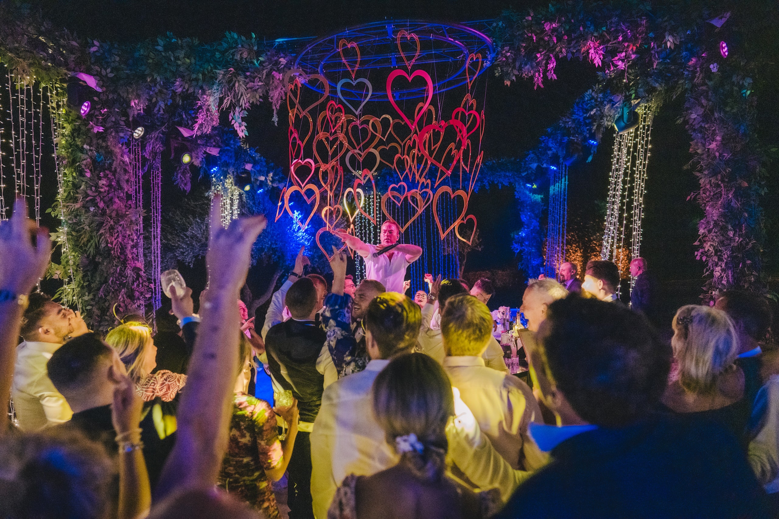 Singer among hanging hearts