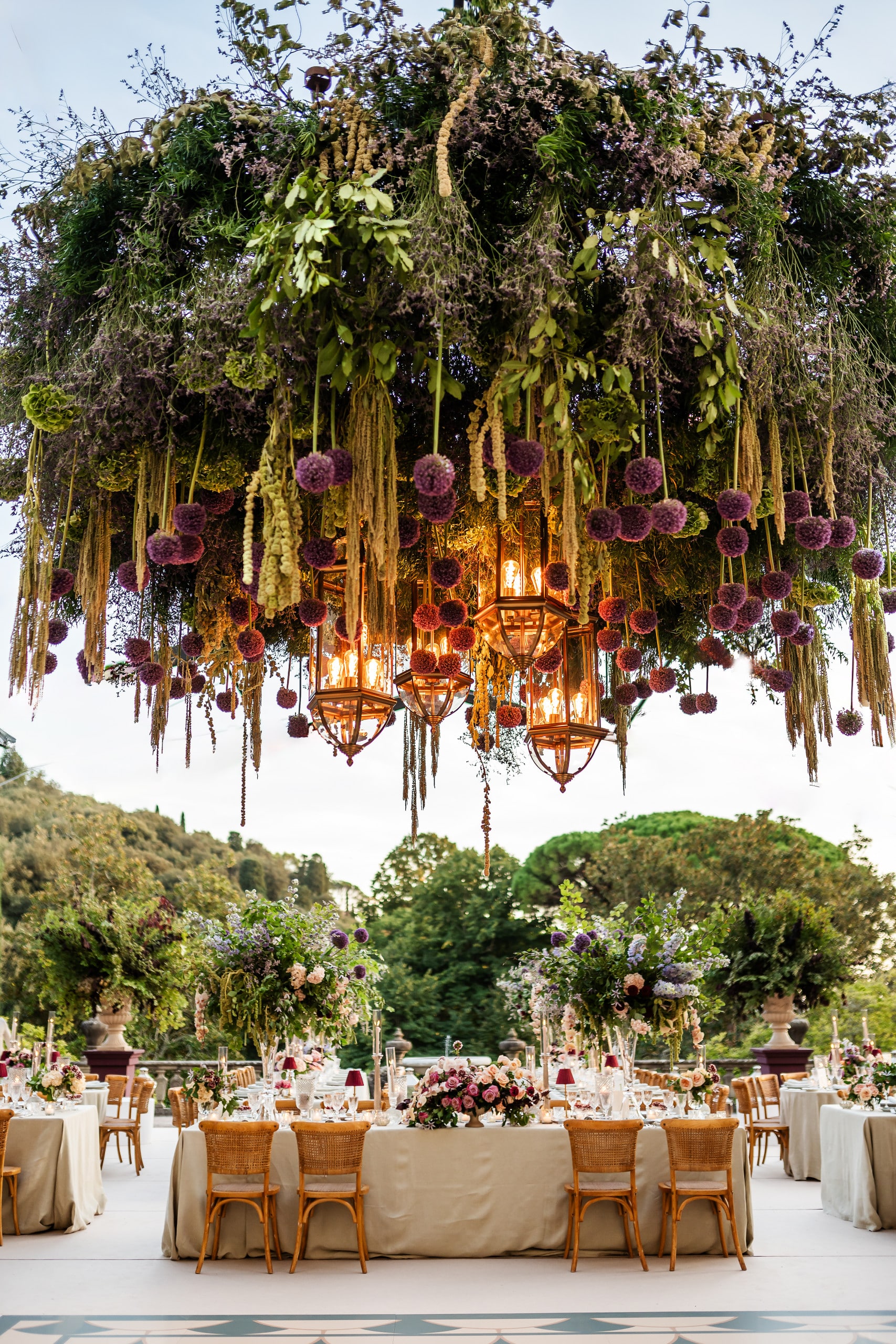 wedding decor with suspended decors with lanterns and greenery